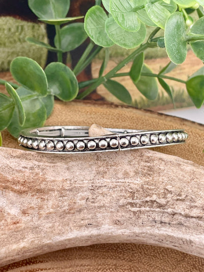 silver studded bracelet on display