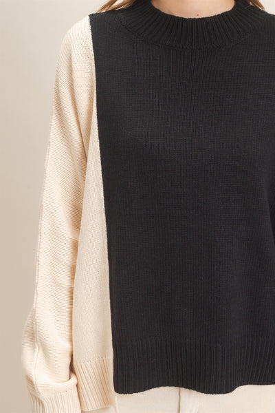 close up of black & cream sweater