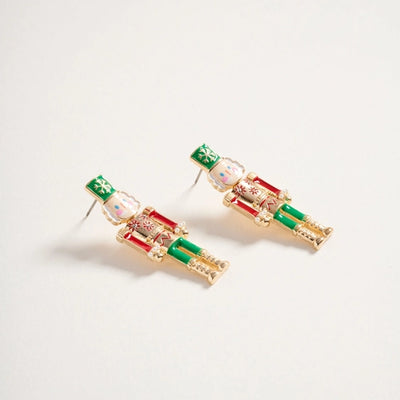 Pair of decorative earrings on a light gray background