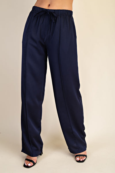 Navy blue pants on a beige background