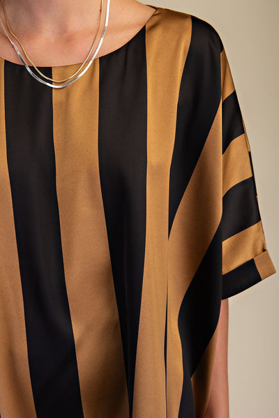 Close-up of a black and brown striped garment with a neutral background