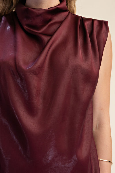 close up of sleeveless burgundy top