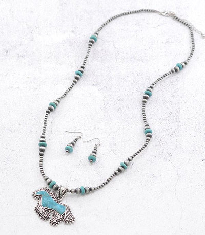 silver & turquoise horse necklace on white background