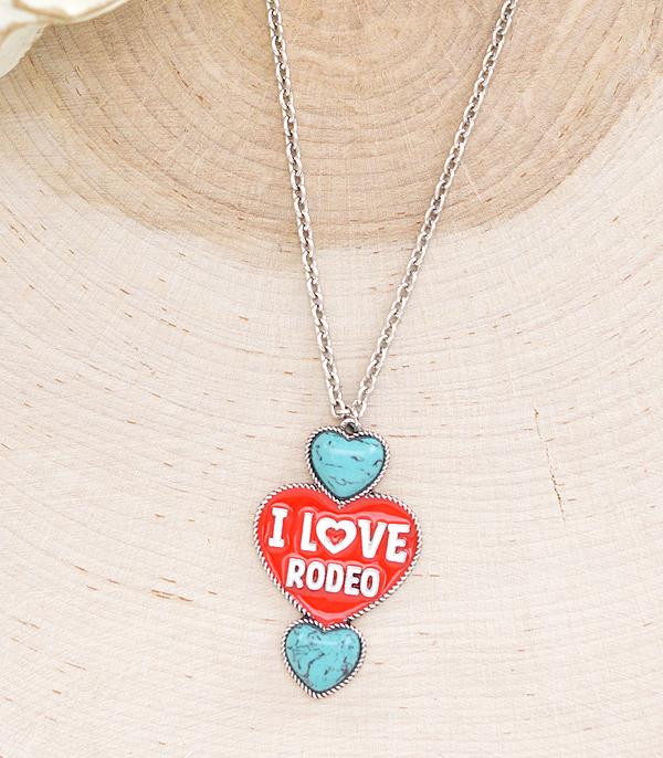red & turquoise I love rodeo necklace on wooden background