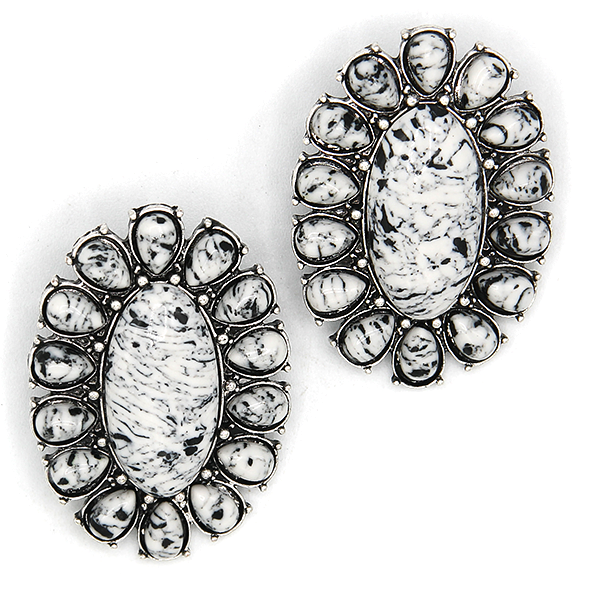 black & white cluster earrings on a light background