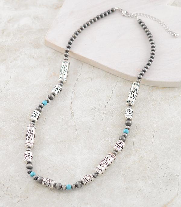 Necklace with turquoise beads and silver accents on a light background