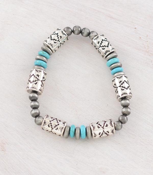Bracelet with silver beads and turquoise accents on a light background