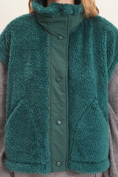 close up of green Sherpa vest