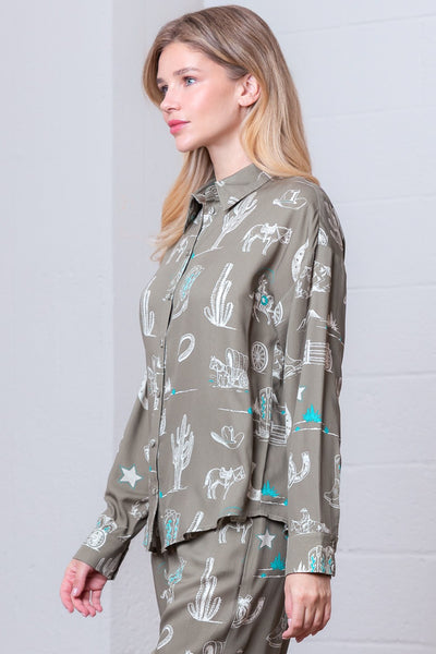 Woman wearing a patterned shirt with a neutral background