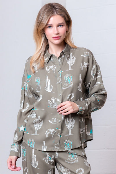 Woman wearing a patterned shirt with a neutral background
