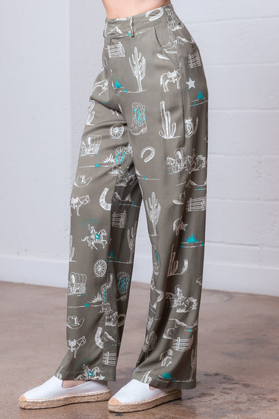 Green pants with a pattern of white illustrations on a plain background
