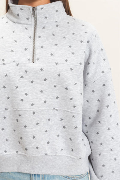 close up of gray sweatshirt with stars