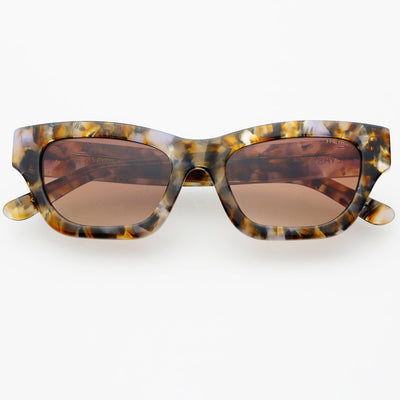 Sunglasses with tortoiseshell frame and brown lenses on a white background