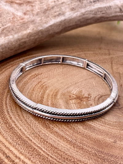 silver bracelet on wooden background