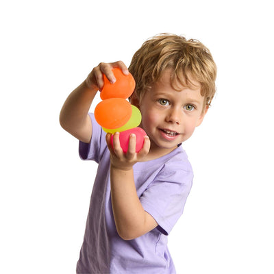 Child holding a colorful toy with a white background