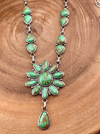 close up of cluster necklace on wooden background