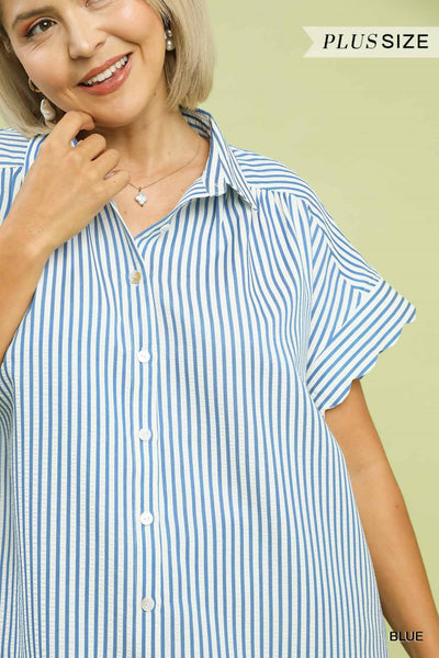 Woman wearing a blue and white striped shirt with 'Plus Size' text above.