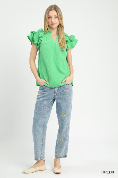 model wearing green v neck top & jeans
