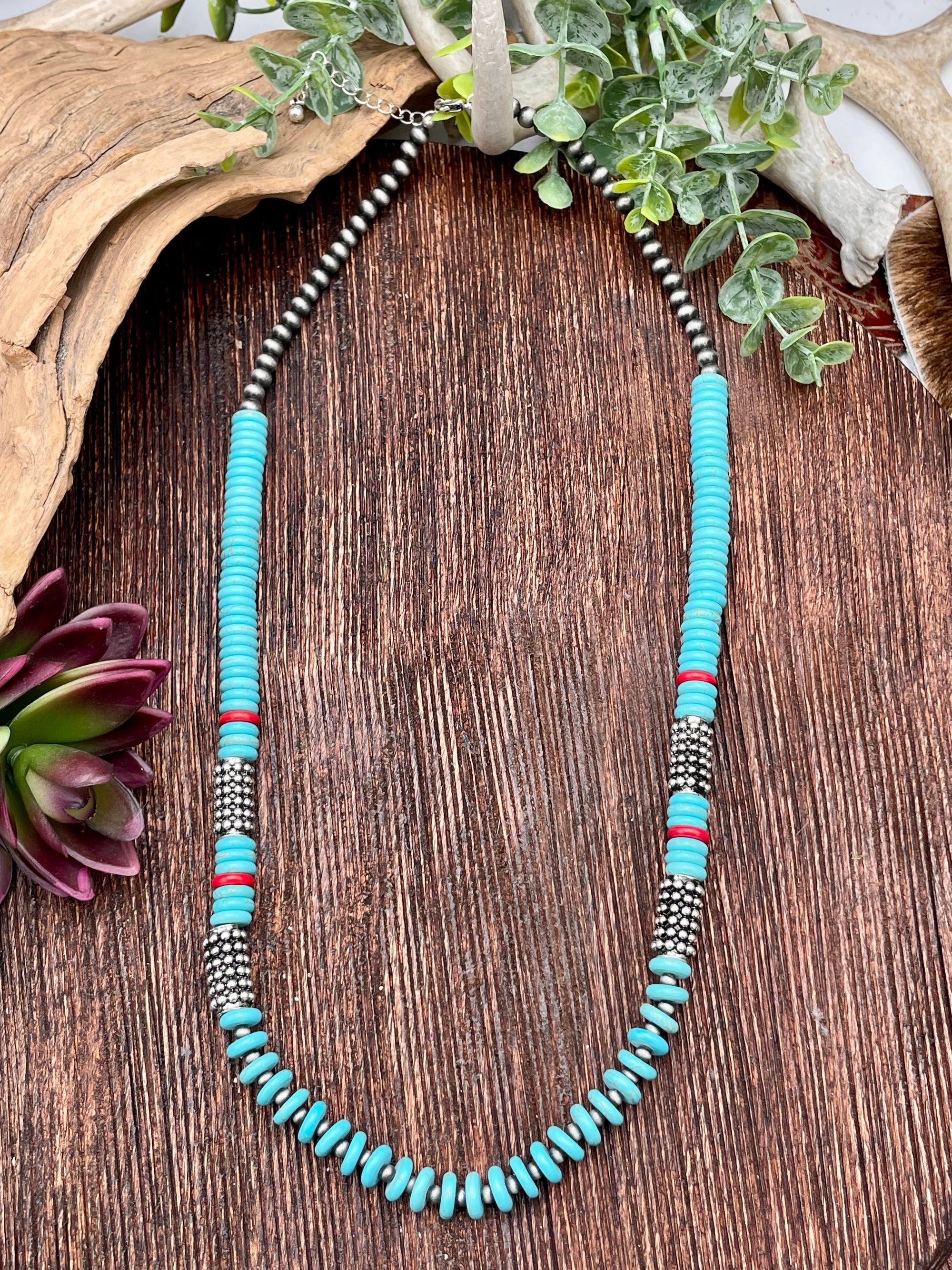 Necklace with turquoise beads on a wooden surface