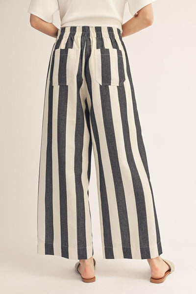 model wearing black stripe pants