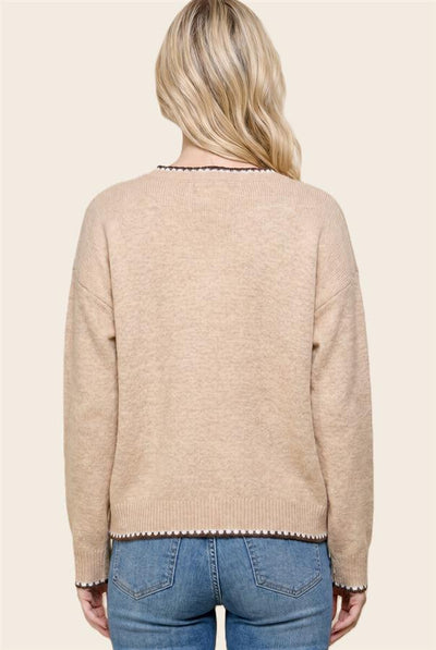 back of model wearing a taupe sweater