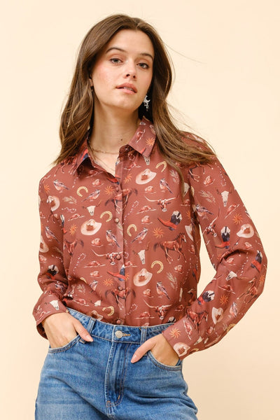 Woman wearing a patterned shirt and distressed jeans on a beige background