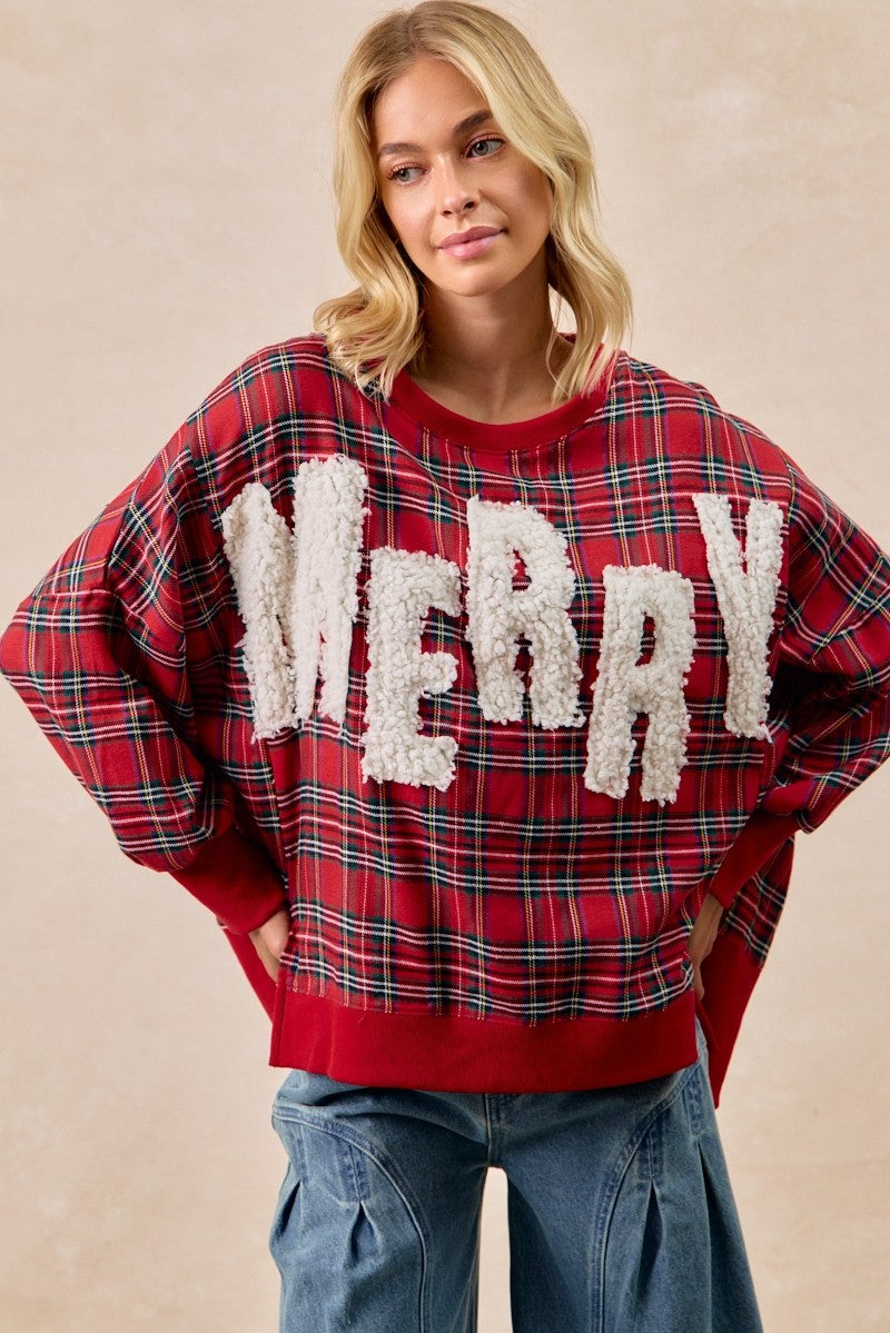 Person wearing a red plaid sweater with 'MERRY' text on a beige background