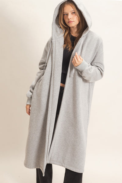 model wearing a black outfit with oversized long gray coat