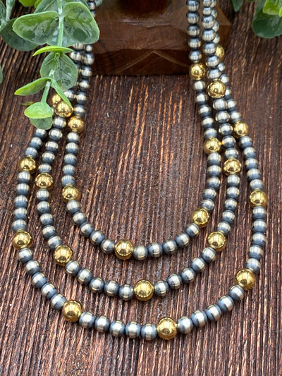 Varied Sterling Silver Necklace With 8mm Gold - 5 to 1 grouping