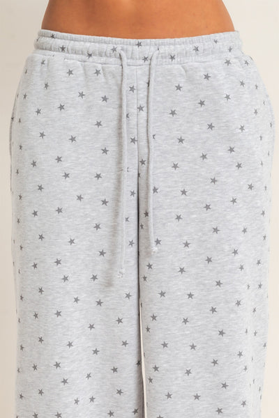 close up of gray drawstring pants with stars