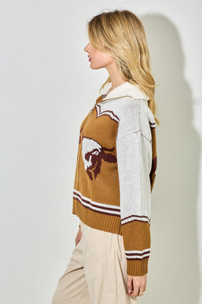 Person wearing a patterned sweater with a white background