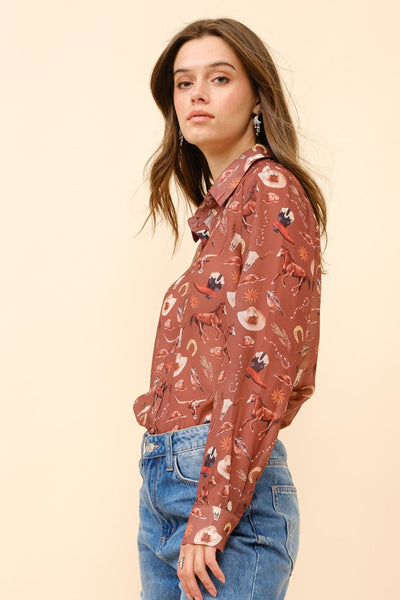 Woman wearing a patterned blouse and blue jeans on a beige background