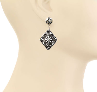 silver concho earring on a mannequin