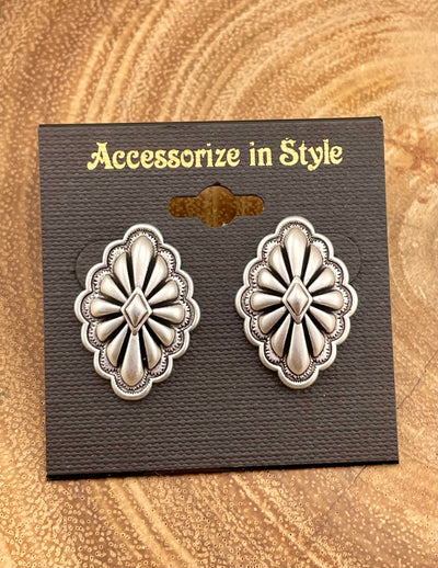 Diamond center concho earrings on a 'Accessorize in Style' card with a wooden background