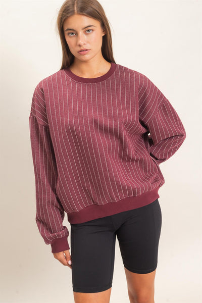 back of sweatshirt and black shorts with a light background