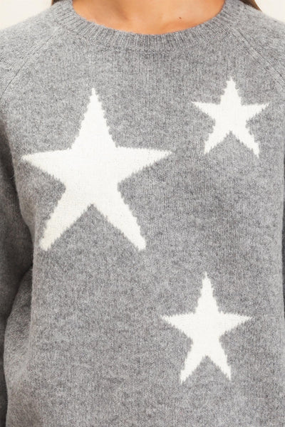 close up on gray sweater with white stars