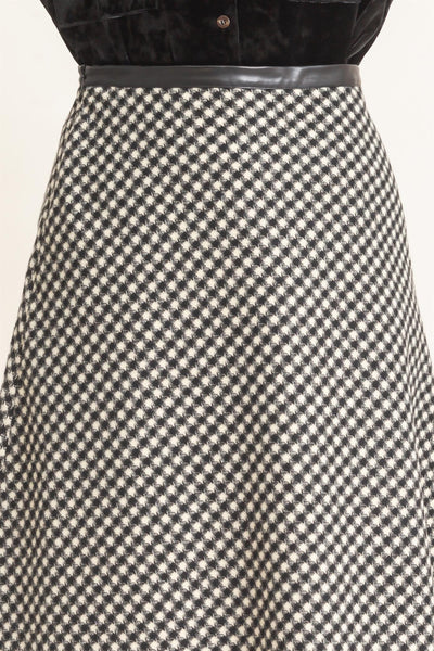 close up of black checkered skirt