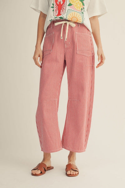 model wearing a red striped drawstring pants with a tshirt