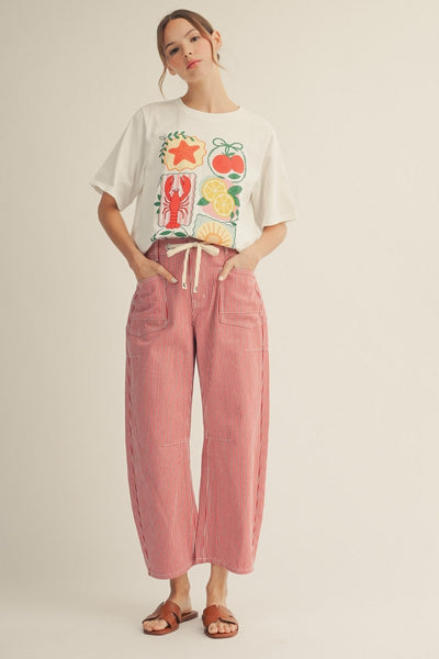 model wearing a red striped drawstring pants with a tshirt