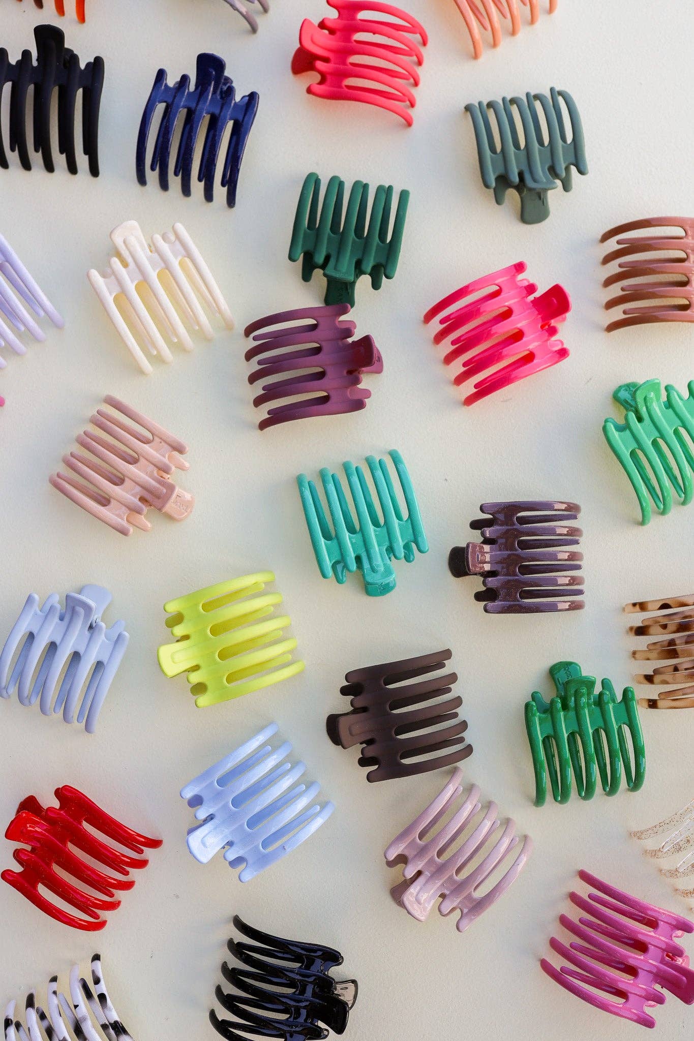 Assorted colorful hair clips on a white background