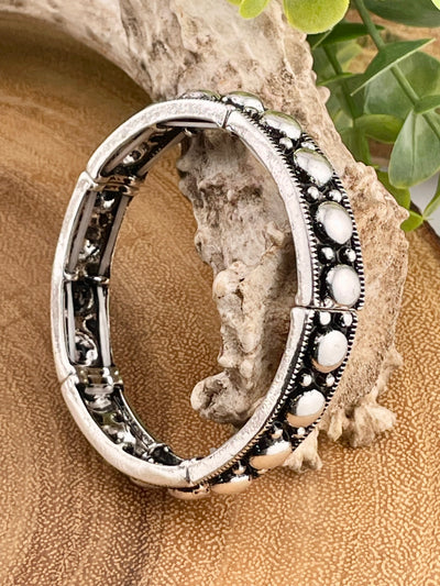 silver bracelet on wooden background