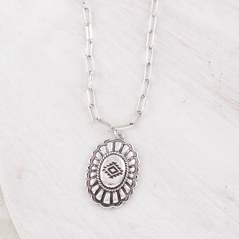 fashion silver Concho necklace on white background