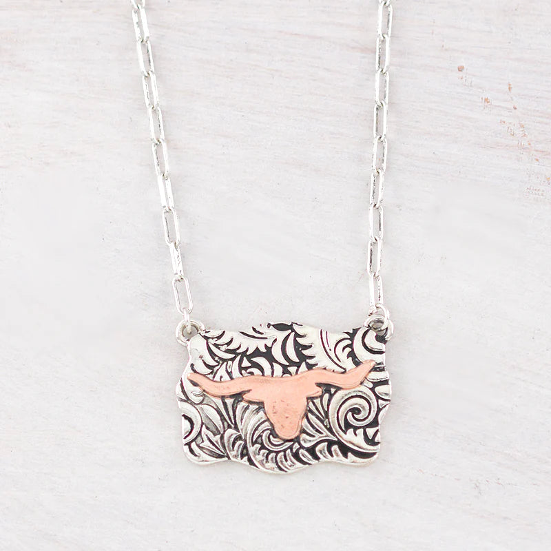 Two tone Longhorn necklace on white background