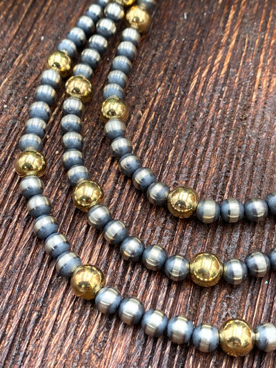 Varied Sterling Silver Necklace With 8mm Gold - 5 to 1 grouping