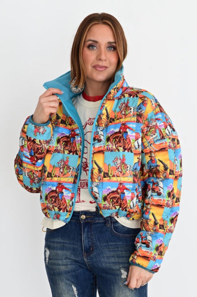 Person wearing a colorful patterned jacket and blue jeans against a white background