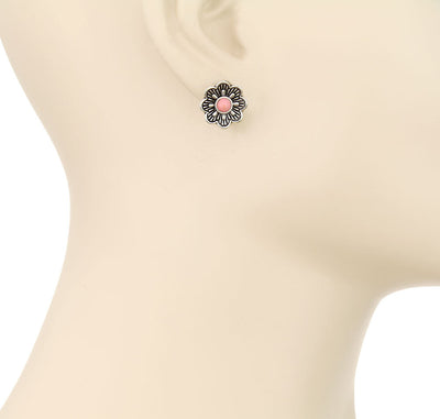 Flower-shaped earring on a mannequin