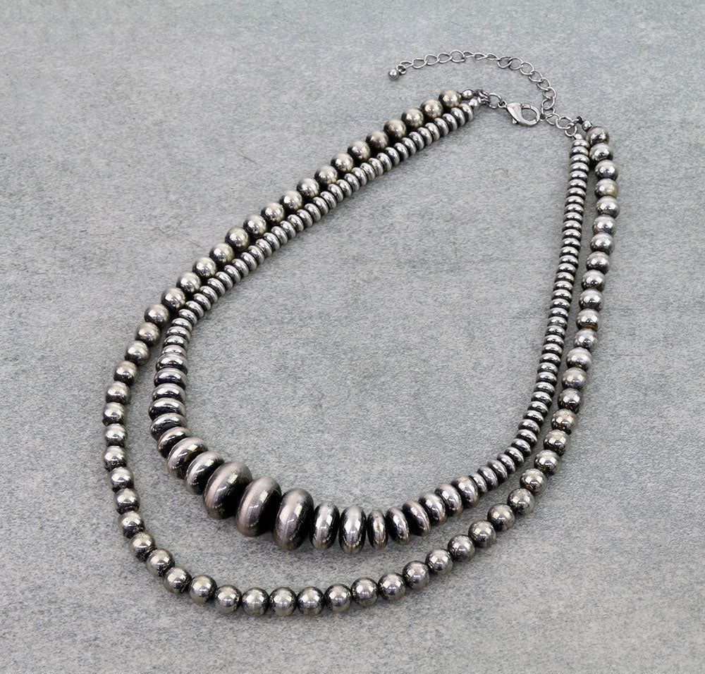 double strand necklace on a gray background