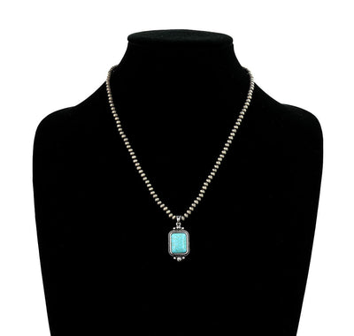 silver bead necklace with turquoise pendant