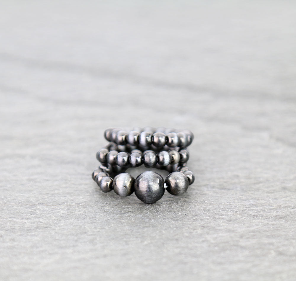 bead stretch ring set on gray background