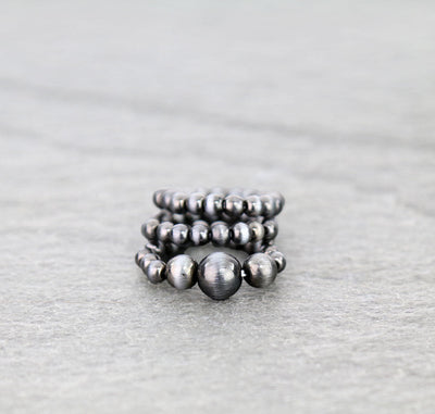 bead stretch ring set on gray background